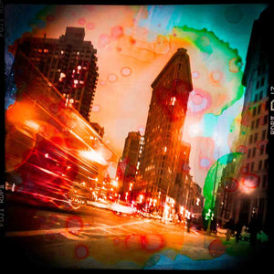 flatiron building with blurred lights from passing cars pop art mixed media photo with paint splashes and intense colors