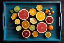 Load image into Gallery viewer, fine art color still life of sliced citrus, oranges and lemons on a rustic blue tray
