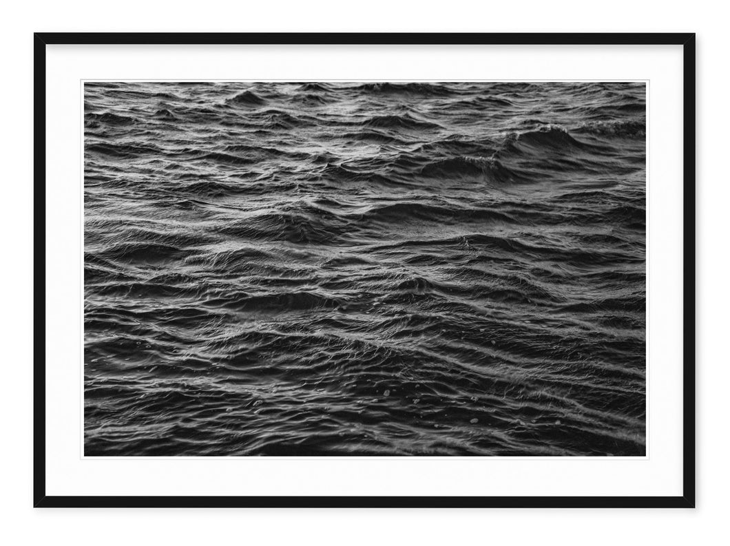 black and white landscape image of rippling water in style of joy division