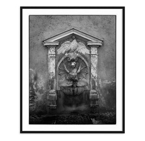 black and white fine art image of nasone fountain in rome italy with dragon and eagle