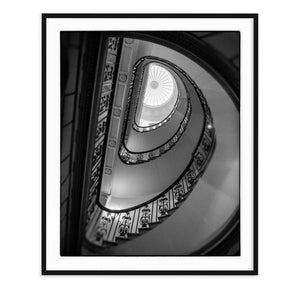black and white fine art image of spiral staircase and skylight
