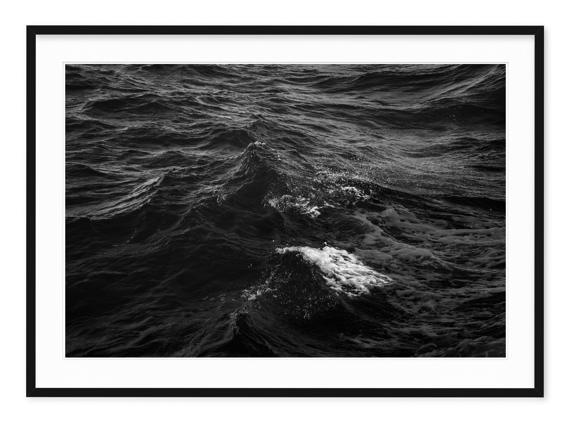 black and white landscape of black water with white foamy peaks